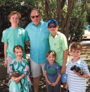 Steve Uhlfelder is surrounded by his grandchildren.