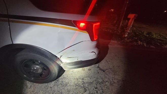 A driver struck a sheriff's vehicle Sunday night as an investigation into a separate traffic collision was underway, sheriff's officials said.