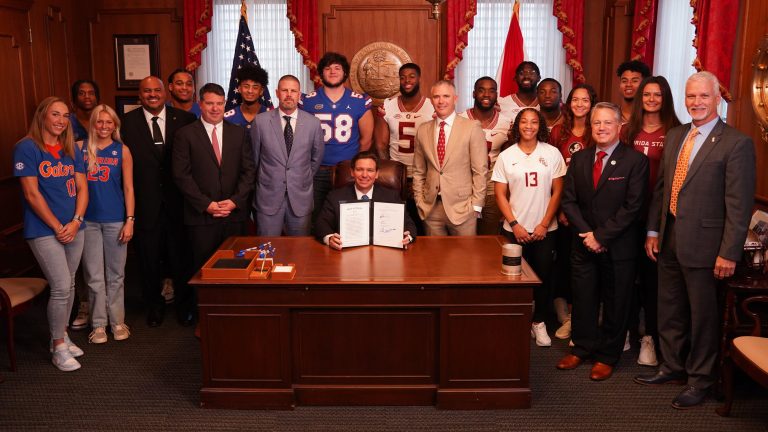 DeSantis signs bill with Norvell, Napier present to help Florida college athletes with NIL