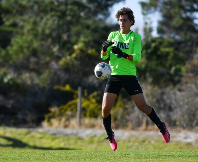 The Pine School's goalkeeper Javi Barbosa corrals a loose ball in the Regional 2-2A final against Lakeland Christian on Feb. 15, 2023, at the Pine School in Hobe Sound. The Pine School won 2-0.