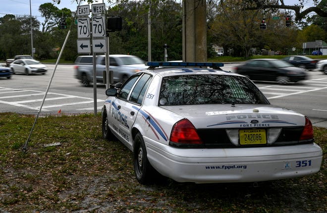 A Fort Pierce police Ford Crown Victoria patrol car is seen vacant and parked at the corner of South 13th Street and Virginia Avenue on Thursday, Jan. 26, 2023, in Fort Pierce. Law enforcement agencies are using vacant patrol vehicles as decoys to help deter speeding.