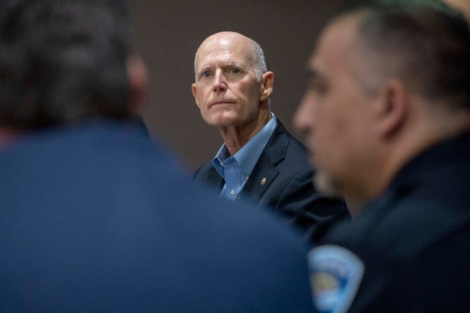 U.S. Senator Rick Scott listens during a roundtable discussion with local law enforcement leaders about border control and the deadly Fentanyl crisis during his visit to the West Palm Beach Police station on February 3, 2023.