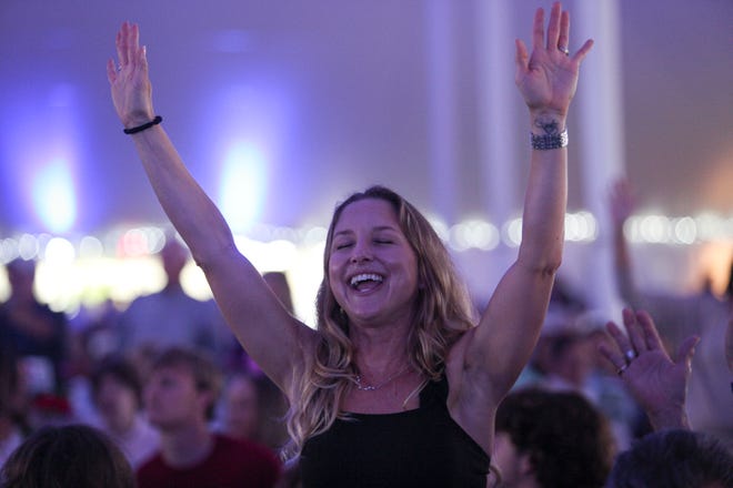 Mary Hope, of Vero Beach, sings along with Grammy and Dove award-winning artist Guy Penrod during the Vero Beach Prayer Breakfast on Thursday, Feb. 16, 2023, in Vero Beach. "I love every second of this," Hope said. "It's great to be around like-minded people who love the Lord." Approximately 2,000 people were in attendance under a tent the length of a football field, along with keynote speaker Tim Tebow, for the 19th annual breakfast.