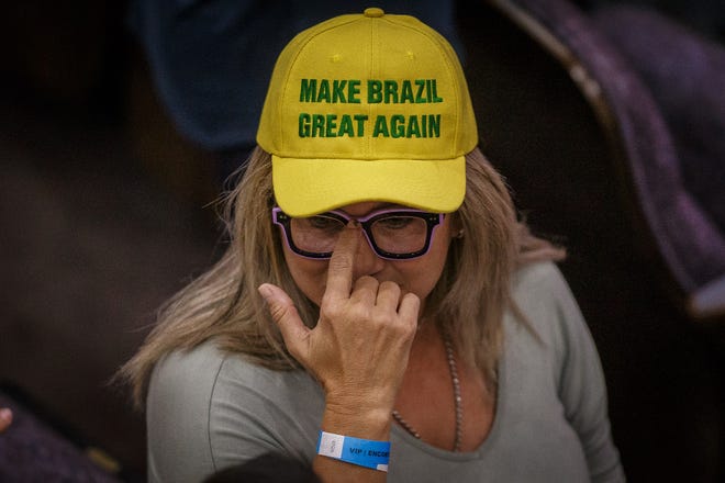 Supporters of former Brazilian President Jair Bolsonaro gather inside the Church of All Nations in Boca Raton, Fla., before his speaking engagement on February 11, 2023.