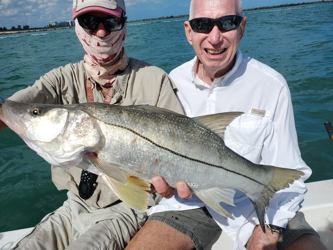 Did a customer of HookASnook.com Capt. Tim Simos catch and released a tarpon snook?