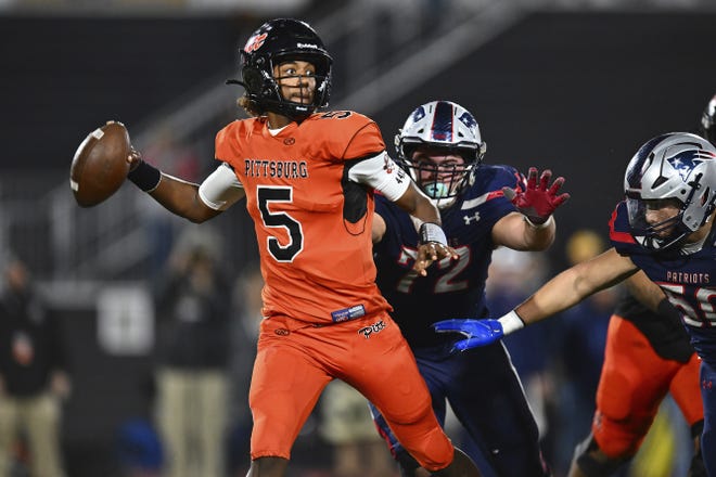 Pittsburg quarterback Jaden Rashada (5) is pressured by Liberty's Grant Buckey (72) during the second quarter of the 2022 CIF State Football Championship Division 1-A game at Saddleback College in Mission Viejo, Calif., on Dec. 10, 2022. Florida has granted Rashada a release from his national letter of intent. It comes three days after he requested to be let go because the Gator Collective failed to honor a four-year name, image and likeness deal worth more than $13 million. (Jose Carlos Fajardo/Bay Area News Group via AP)