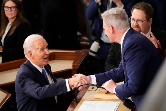 President Joe Biden greets House Leader Kevin McCarthy of Calif. during the State of the Union address from the House chamber of the United States Capitol in Washington.