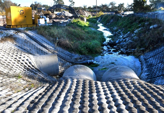 Example of a stormwater mitigation technique comprised of a baffle box, two stormwater ponds and two “rain gardens” off of Robin Hood Drive in Melbourne's Sherwood Park subdivision.