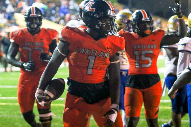 Lakeland's Larry Jones reacts after scoring a touchdown against Osceola in the third quarter.