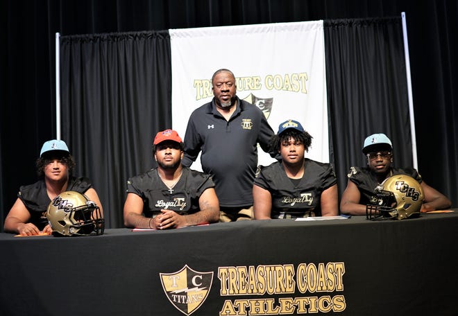 Treasure Coast High School seniors Christian Ware-Terry (Keiser),  Alex Woods (SMU), Corey McIntyre, Jr. (West Virginia) and Kymani Edwin (Keiser) celebrated their signings with head coach Irvin Jones on National Signing Day taking place Wednesday, Feb. 1, 2023 in the school's auditorium.