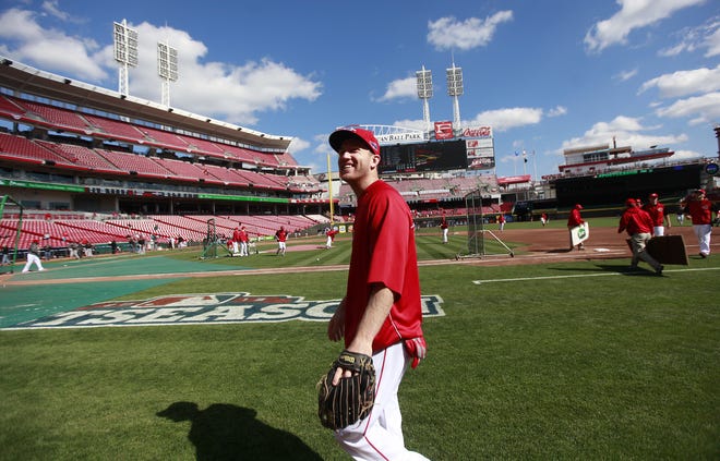 Todd Frazier smiles at fans before he walks into the clubhouse before a Cincinnati Reds game in 2012.