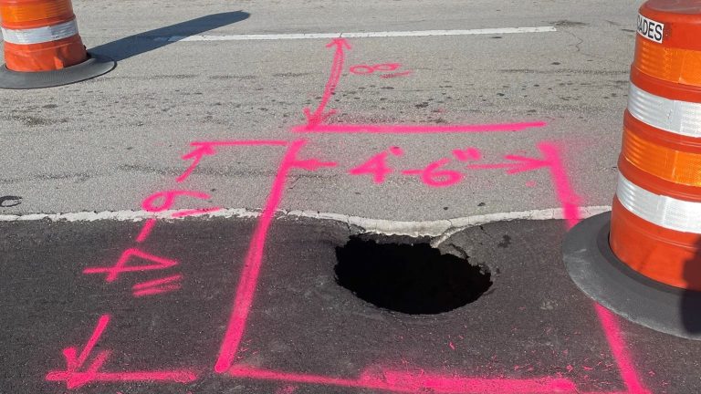 Crews cover hole on Kanner Highway to reopen lane