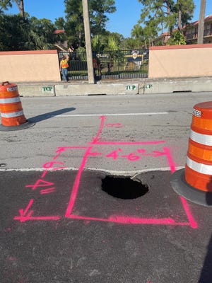 Stuart city crews on Thursday Feb. 23, 2023 repair a portion of Kanner Highway between Monterey Road and U.S. 1 after what was described as a 5-foot by 6-foot sinkhole was reported there Wednesday evening. It is in the left turn lane onto Central Parkway.