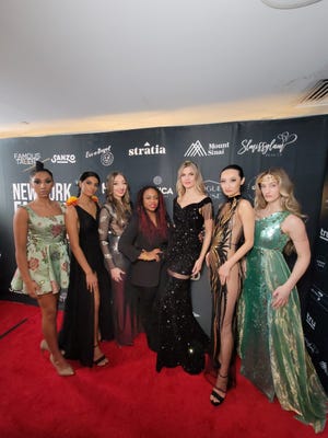 Models pose with designer Kallee Jackson (middle) during New York Fashion Week 2023 on Feb. 11, 2023.