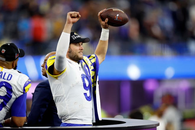 Los Angeles Rams quarterback Matthew Stafford (9) celebrates, holding the ball in the air after winning the NFL Super Bowl 56 football game against the Cincinnati Bengals, Sunday, Feb. 13, 2022 in Inglewood, CA.