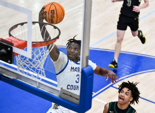 Martin County's Elijah Duval (3) makes a 2-point basket against Viera in a boys basketball Region 2-6A quarterfinal, Thursday, Feb. 16, 2023, at Martin County High School in Stuart. Viera won 67-64.