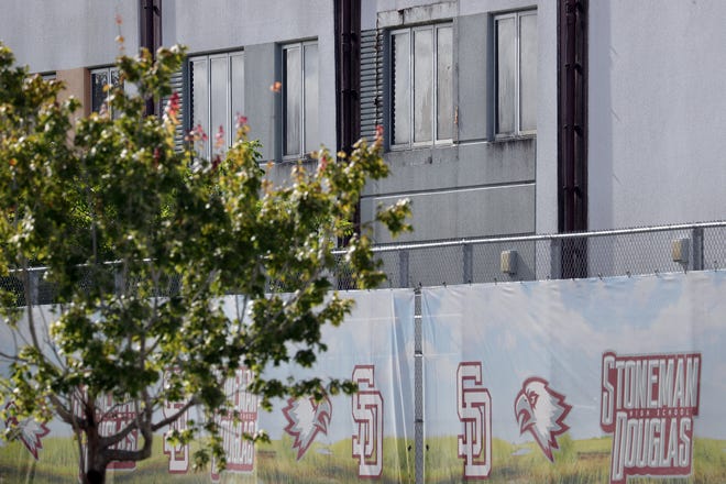 A bullet hole can be seen in a second floor window of the “1200 building,” the crime scene where the 2018 shootings took place, at Marjory Stoneman Douglas High School in Parkland on Thursday, August 4, 2022. This during the penalty phase in the trial of confessed shooter Nikolas Cruz who previously plead guilty to all 17 counts of premeditated murder and 17 counts of attempted murder. Cruz waived his right to be present at the viewing.