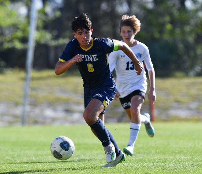 The Pine School's Julian Restrepo (6) goes for a loose ball in the Regional 2-2A final against Lakeland Christian on Feb. 15, 2023, at the Pine School in Hobe Sound. The Pine School won 2-0.
