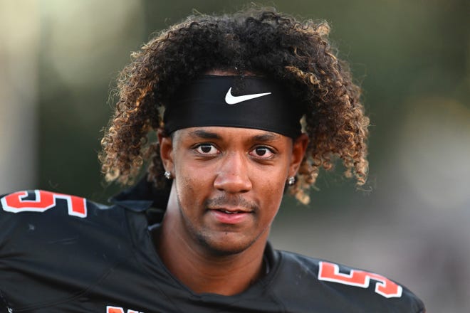 FILE - Pittsburg quarterback Jaden Rashada warms up before the start of their game against McClymonds at Pittsburg High School in Pittsburg, Calif., Sept. 30, 2022. Using name, image and likeness (NIL) compensation to recruit college athletes is still very much against NCAA rules. The recent de-commitment from Florida by blue chip quarterback Rashada shows that NIL is definitely a factor in decisions. (Jose Carlos Fajardo/Bay Area News Group via AP, File)