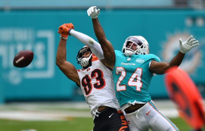 Miami Dolphins cornerback Byron Jones (24) breaks up a pass intended for Cincinnati Bengals wide receiver Tyler Boyd (83) in the first half at Hard Rock Stadium in Miami Gardens, December 6, 2020.