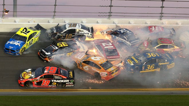 Multiple cars crash in turn 3 during the NASCAR Daytona 500 auto race at Daytona International Speedway, Sunday, Feb. 17, 2019, in Daytona Beach, Fla. (AP Photo/Gary McCullough)