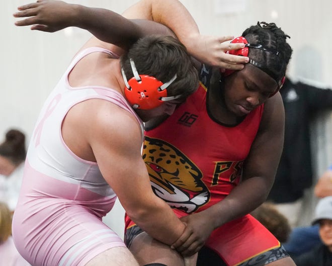 Port St. Lucie's Jabarie Yearby (right) wrestles Charlotte's Nikko Frattarelli in the 285 pound match during the Cradle Cancer Invitational wrestling tournament on Saturday, Jan. 7, 2023, at Jensen Beach High School.