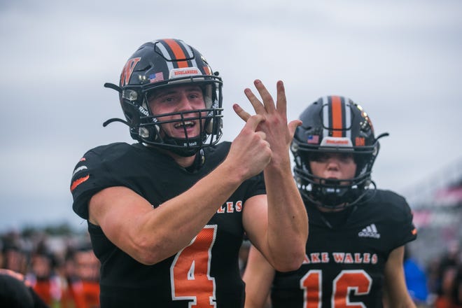 Lake Wales quarterback Trent Grotjan (4) gestures to his ring finger after the end of the second half of the Class 3S football state championship game between Lake Wales and Mainland at DRV PNK Stadium on Friday, December 16, 2022, in Fort Lauderdale, FL. Final score, Lake Wales, 32, Mainland, 30.