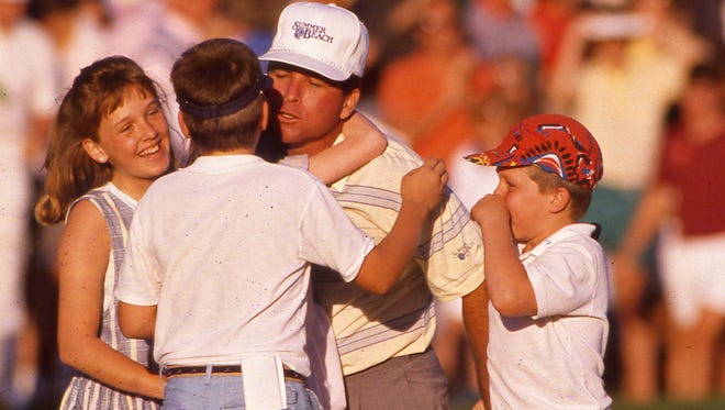 FILE PHOTO: Dennis Hamilton Jr./The Times-Union -- 3/27/88 -- Mark McCumber celebrates his win in The Players Championship in 1988 with his family.