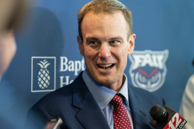 Tom Herman talks to reporters Friday at FAU after being introduced as the Owls' new head football coach.