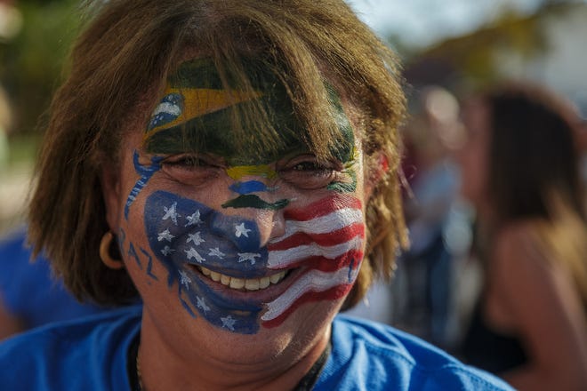 Supporters of former Brazilian President Jair Bolsonaro gather outside the Church of All Nations in Boca Raton, Fla., before his speaking engagement on February 11, 2023.