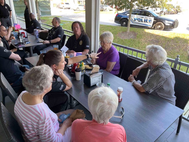 Officer Rachael Minor speaks with community members at City Diner on February 17, 2023, about Stuart police receiving new radar equipment.