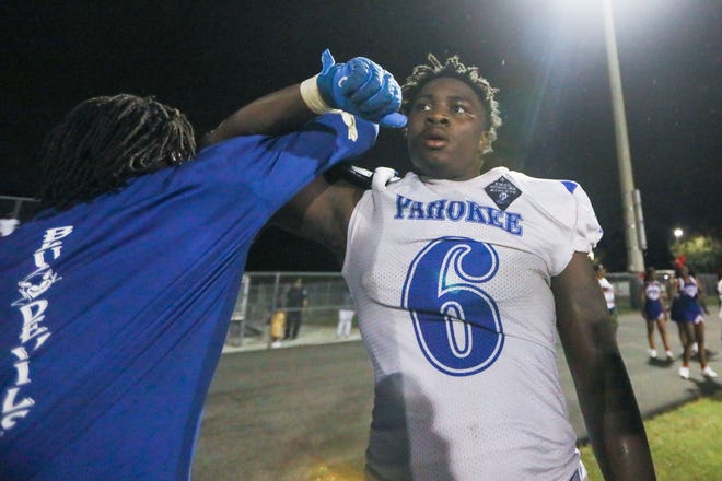 Pahokee defensive end Deejay Holmes Jr. (6) celebrates a pick-six late in the fourth quarter during the football game between Pahokee and host Palm Beach Central on Friday, September 16, 2022, in Wellington, FL. Final score, Pahokee, 34, Palm Beach Central, 14.