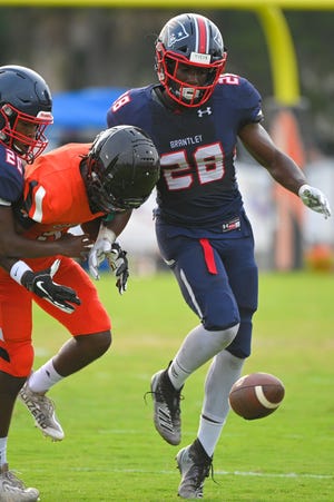 Lake Brantley linebacker Andrew Harris (28) signed with UCF on Wednesday.