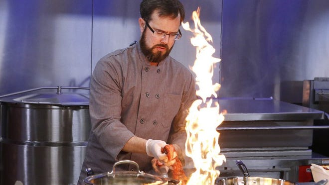 Competitor Eric Grutka cooks a meat-and-potatoes-themed dish with the secret ingredient cookies during the first round, as seen on the April 7 episode of Food Network's "Cooks vs. Cons." (CONTRIBUTED PHOTO FROM THE FOOD NETWORK)