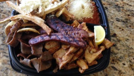 Mr. Gyros' combo platter had beef and lamb gyros, chicken gyros and Greek sausage. The meal came with the choice of two sides.