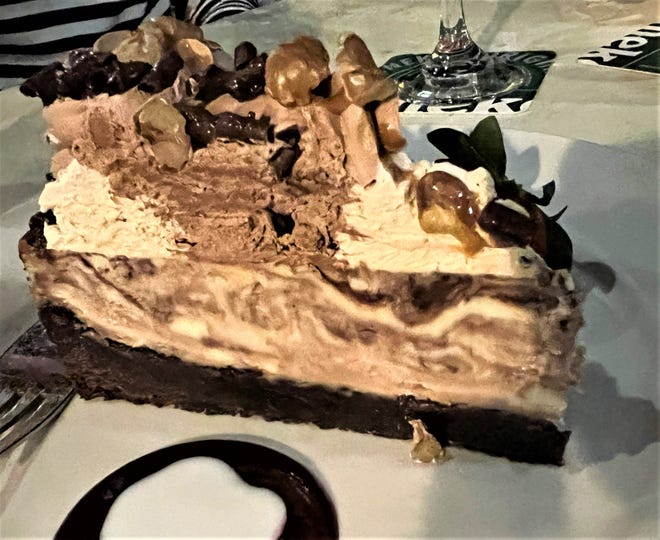 The Millionaire's Cheesecake at Sailor's Return had a chocolate crust, a swirled chocolate and vanilla cheesecake, topped with whipped cream, chocolate mousse, and some other edible adornments.
