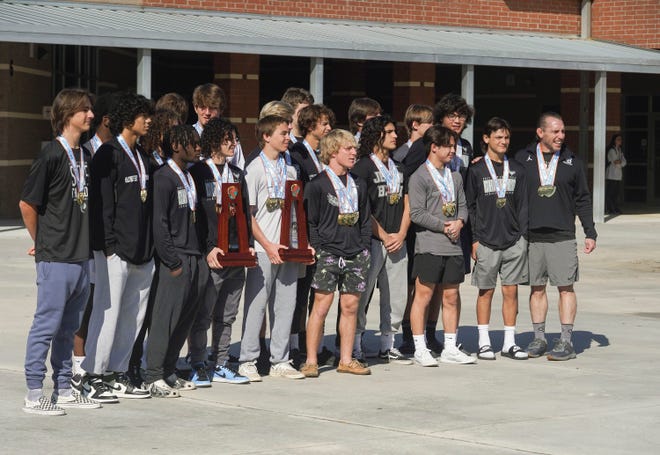 Students, faculty and family congratulate the Jensen Beach boys wrestling 1A state champions in the school's courtyard, Tuesday, March 21, 2023.