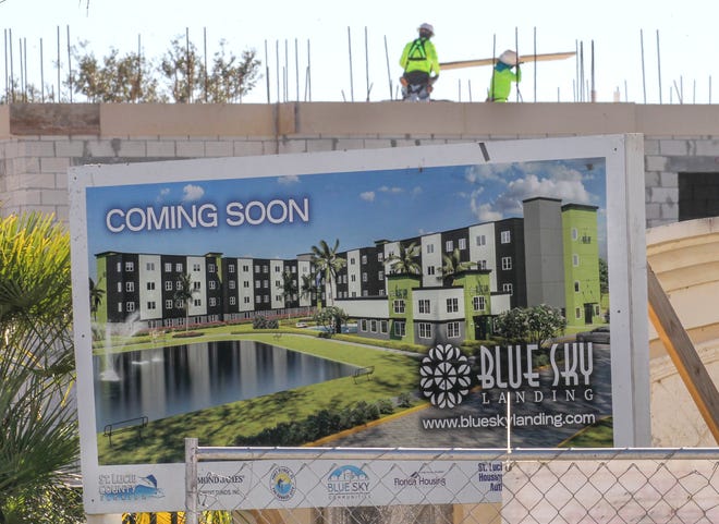 Construction crewmen work on the roof of phase 2 of the new Blue Sky landing apartment complex under construction along McNeil Road on Monday, Feb. 13, 2023, in Fort Pierce.