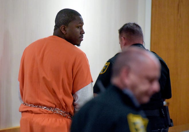 Alton Lee Edwards, a former Martin County High School boys basketball assistant coach, looks back toward family after a plea hearing before Judge William Roby on Tuesday, March 7, 2023 at the Martin County Courthouse in Stuart. Edwards pleaded no contest to six counts of lewd computer solicitation of a minor by an authority figure and was sentenced to seven years in prison concurrent on three counts before being transferred to the Department of Corrections