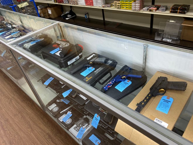 A selection of handguns at Dunkelberger's Sports Outfitter in Brodheadsville. While most guns come with basic safety features like locking mechanisms, experts often recommend that owners should invest in a safe or cabinet for extra protection.