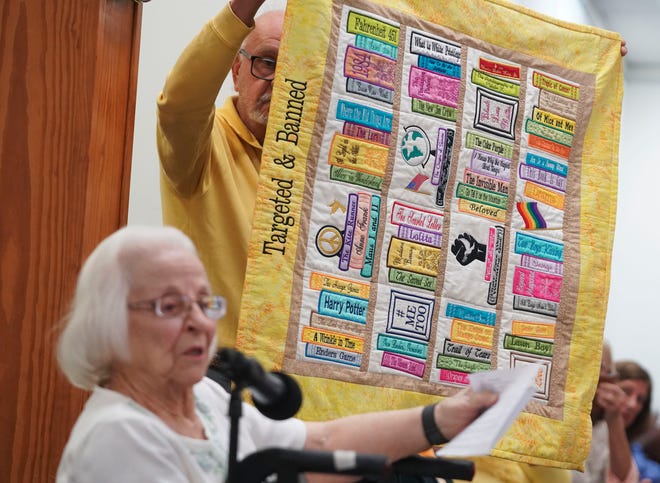 "In response to the book banning throughout our country and Martin County, I have created this quilt to remind all of us that these few of so many more books that are banned or targeted, need to be proudly displayed and protected," said Grace Linn, 100, of Jensen Beach, while addressing the Martin County School Board during public comment, Tuesday, March 21, 2023, at 1939 SE Federal Highway in Stuart. Pulitzer Prize winner Toni Morrison and best-selling young-adult novelist Jodi Picoult are some of the writers whose works were removed from the Martin County School District's middle and high schools last month.