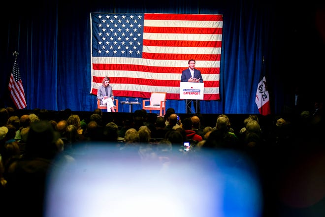 Florida Gov. Ron DeSantis speaks with Iowa Gov. Kim Reynolds during the Freedom Blueprint Event, Friday, March 10, 2023, at Rhythm City Casino Resort in Davenport, Iowa.