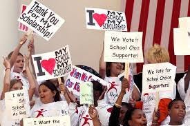 Students show their support for school vouchers at a rally in Tallahassee.