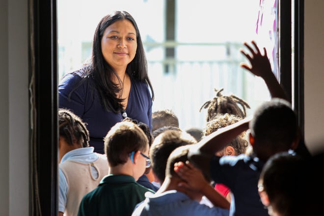 Elena Jaramillo, a kindergarten teacher at River's Edge Elementary in Port St. Lucie, gathers her students for an outdoor activity on Thursday, March 9, 2023.