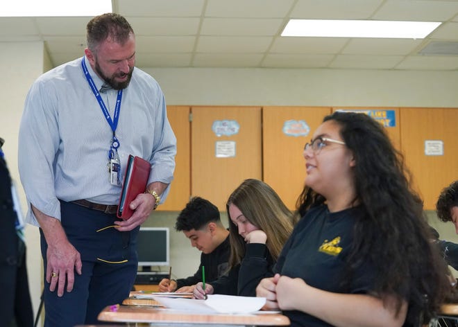 Martin County School District Superintendent John Millay (left) talks with eighth-grade science students while visiting Murray Middle School on the first day of school Wednesday, Aug. 10, 2022, in Port Salerno. "I always share, when I'm talking to the staff prior to the school year, that we don't want to lose the joy," said Millay. "There's a lot of getting things ready, there's a lot of preparation but in the midst of that, it's exciting for kids. We don't want to lose that excitement."