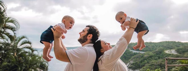 Nicolas del Rosal holds son Mateo while wife Megan holds twin Celeste in August 2022. They were born prematurely in December 2021, followed a year later by the couple's second set of twins.