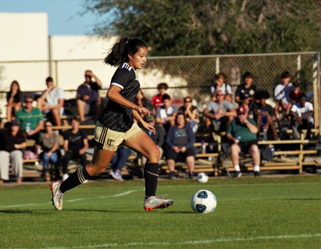 Treasure Coast's Deanna Romero brings the ball up the field during a high school soccer match against Jupiter on Friday, Jan. 6, 2023 in Port St. Lucie. The Warriors won the match 2-1.