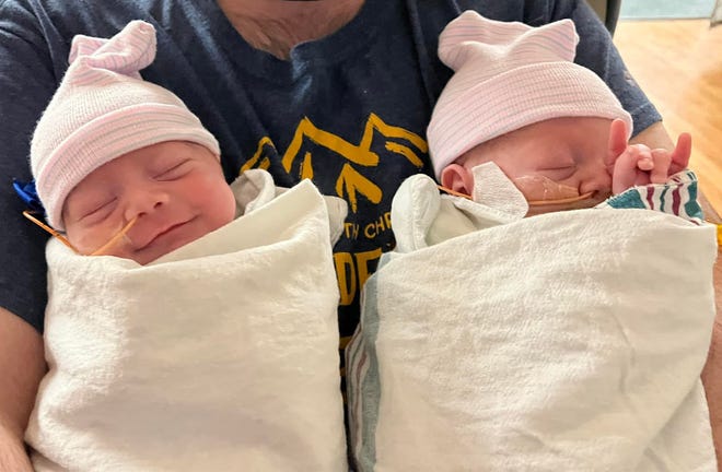 A month or so old twins Celese and Mateo in the arms of their father, Nicolas del Rosal.