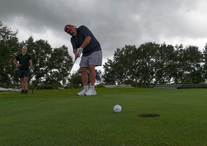 Steve Merrill, of Port St. Lucie comes up short of the hole while golfing with his son Michael Merrill (background), of Jensen Beach, as they play a round of golf on Wednesday, Sept. 22, 2021, at the city-owned The Saints golf course in Port St. Lucie. "It's wide open, It's forgiving, its close to home," Steve Murrell said."  The Saints Golf Course has been selected as a TCPalm's 2021 Best of the Best Treasure Coast contest winner in the Entertainment & Leisure category for locals and tourists.