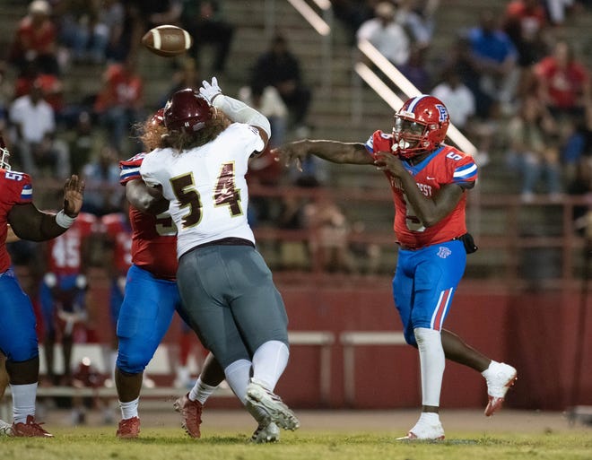 Quarterback Tierra Wilson (5) passes during the Niceville vs Pine Forest football game at Pine Forest High School in Pensacola on Friday, Oct. 7, 2022.